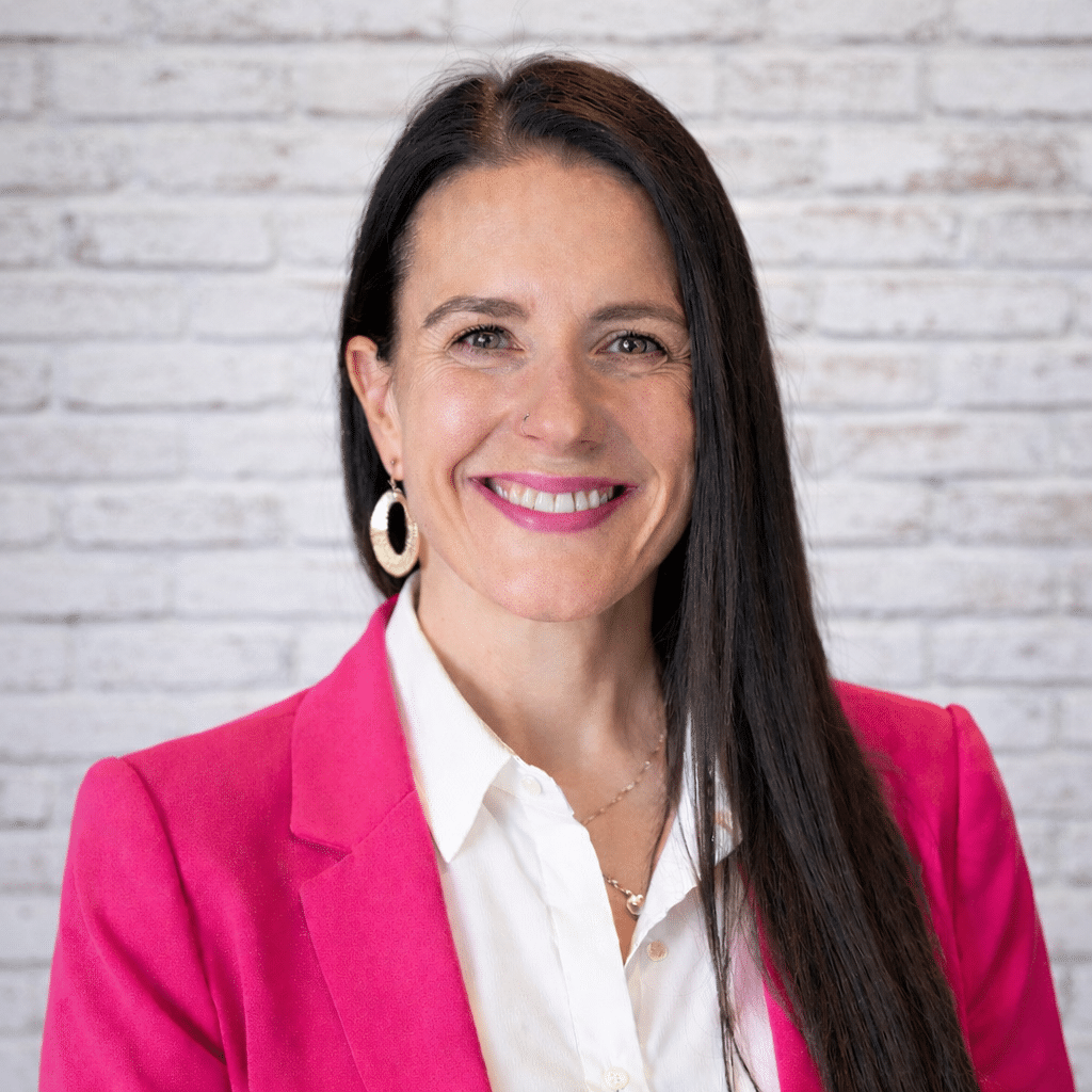image of a woman in a pink blazer from the chest up